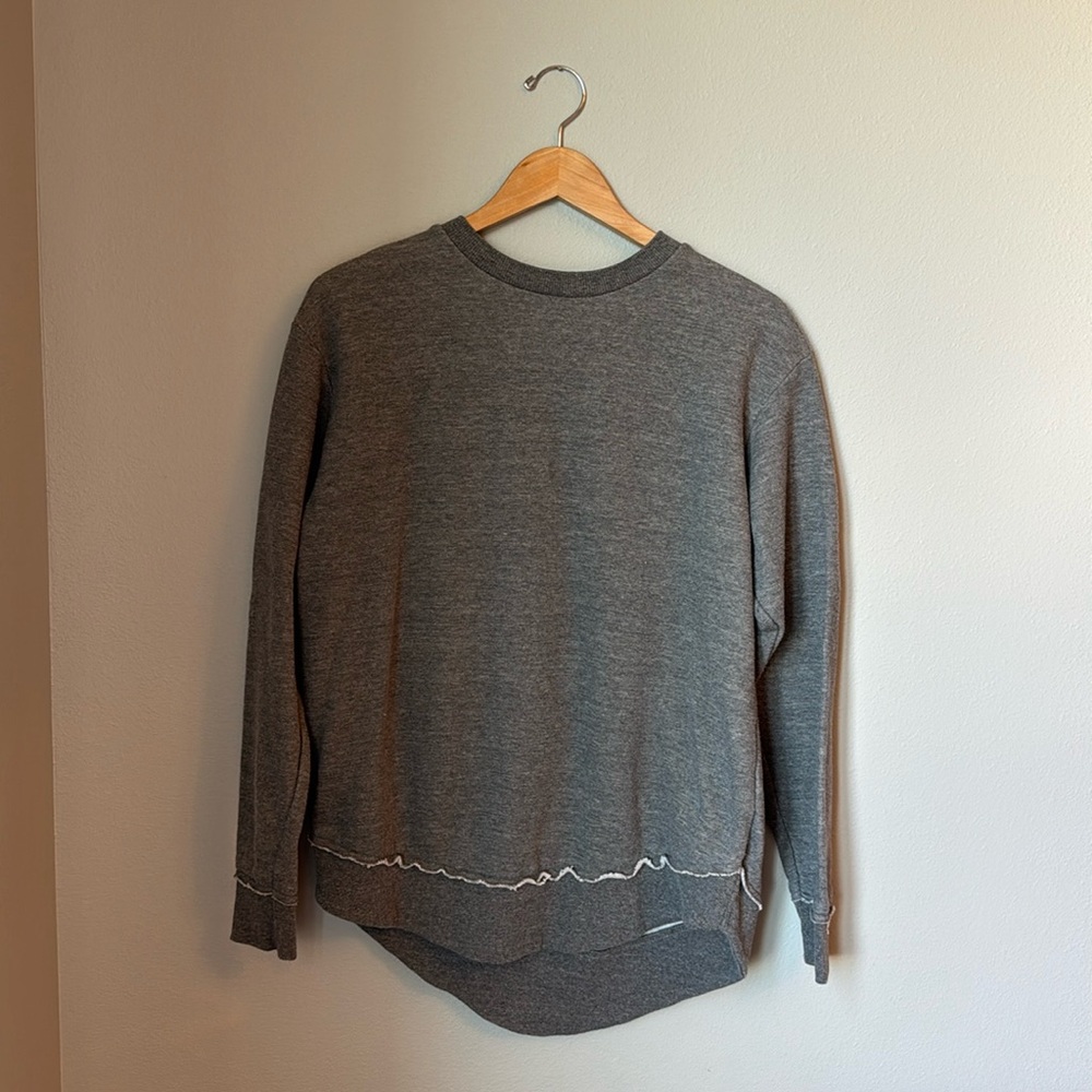 Women’s size medium gray sweatshirt longer in back excellent condition very soft